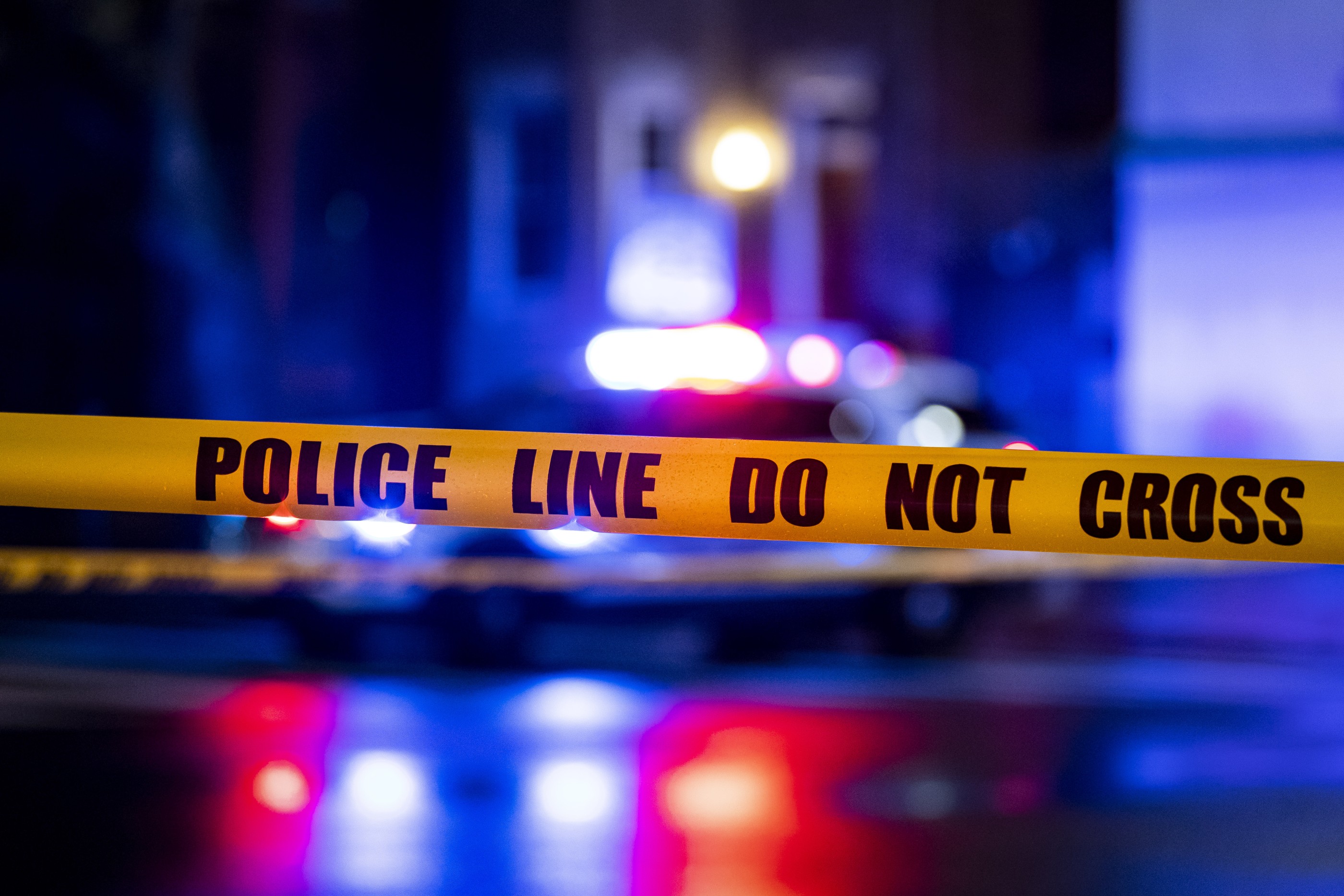 WASHINGTON, DC - MARCH 12: Caution tape hangs as members of the Metropolitan Police Department investigate a shooting between two cars at the 400 block of 11th Street SE, on Sunday, March 12, 2023. One male was pronounced dead at the scene and a second male succumbed to their injuries on the way to the hospital. (Photo by Al Drago for The Washington Post via Getty Images)