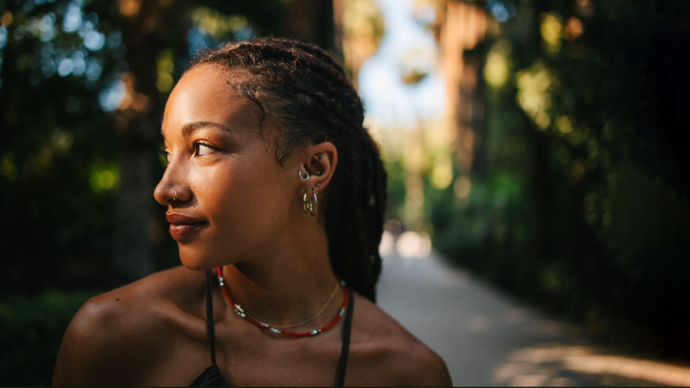 Portrait of a multi-racial woman enjoying a forest. Natural beauty