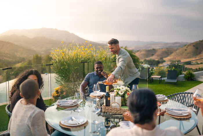 Friends Enjoying an Elegant Dinner in a Luxury Home