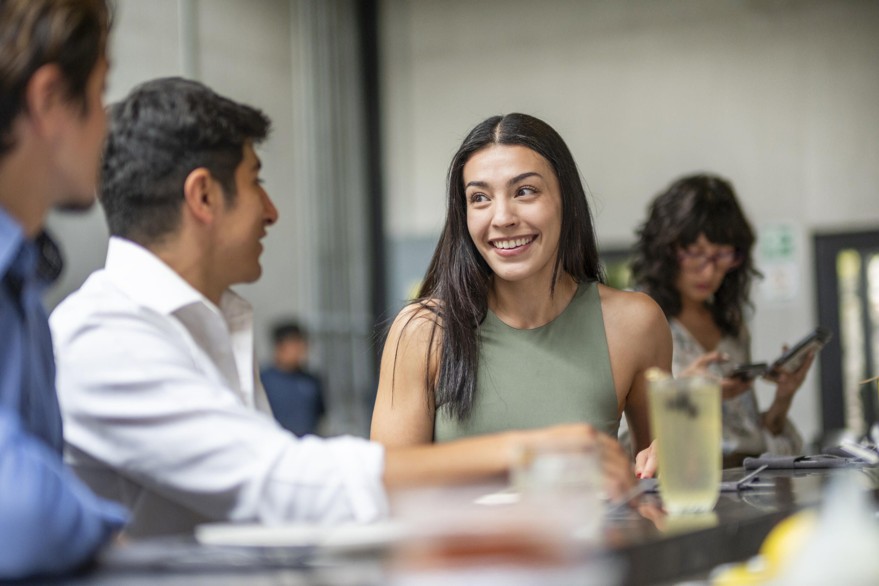 young couple enjoying a nice moment while having a drink in a nice restaurant
