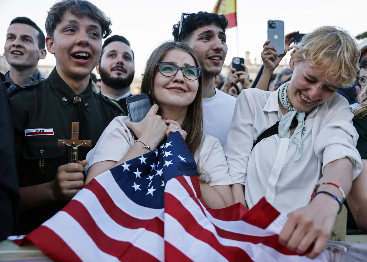 VATICAN CITY, VATICAN - MAY 8: (EDITOR'S NOTE: Alternate crop of 2214207224) A Polish woman (C) who lives in the United States celebrates with her Polish friends after the newly elected Pope Leo XIV spoke for the first time from the Vatican balcony on May 8, 2025 in Vatican City, Vatican. White smoke was seen over the Vatican early this evening as the Conclave of Cardinals took just two days to elect Cardinal Robert Francis Prevost, who will be known as Pope Leo  (Leone)  XIV, as the 267th Supreme Pontiff after the death of Pope Francis on Easter Monday. (Photo by Mario Tama/Getty Images)