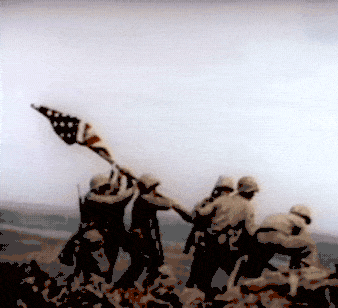 US troops raise the American flag at Iwo Jima.
