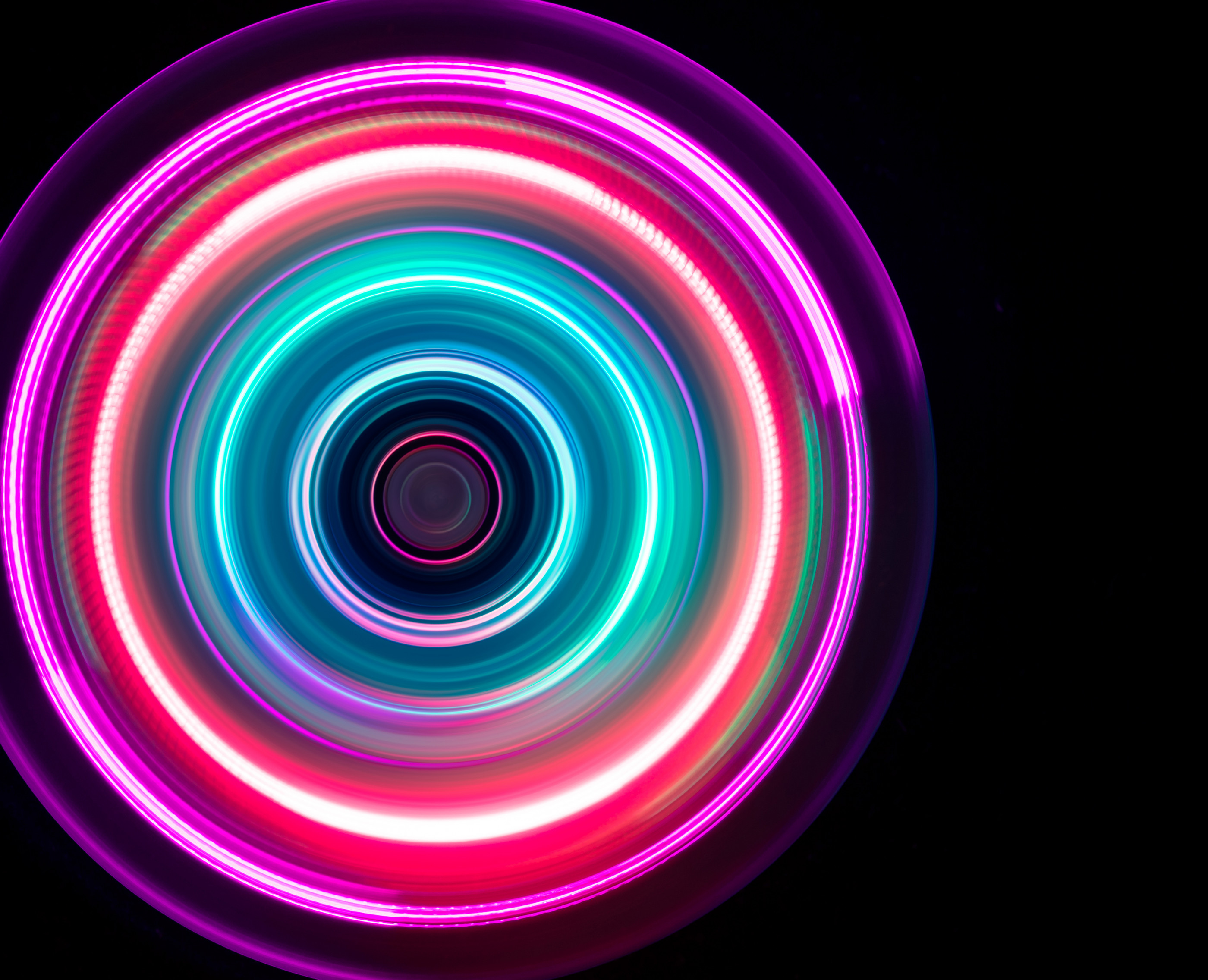 Colorful Light Trail Swirl on Black Background.