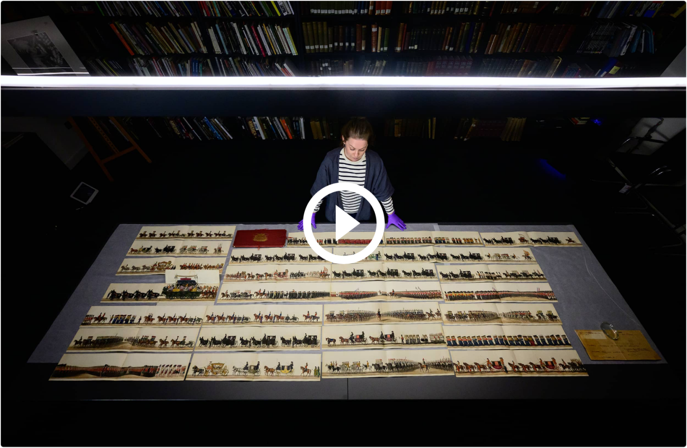A woman looks at prints in the Hulton Archive